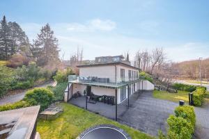 an aerial view of a house with a patio at Luksus Lejlighed i Højbjerg m gratis parkering in Højbjerg +4 photos