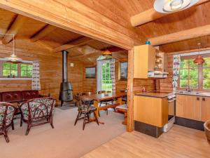 a kitchen and dining room with a table and a stove at 6 person holiday home in Roslev-By Traum in Roslev