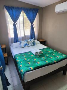Postel nebo postele na pokoji v ubytování Villas Susurro Del Mar