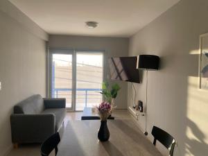 TV a/nebo společenská místnost v ubytování Edificio Hudson