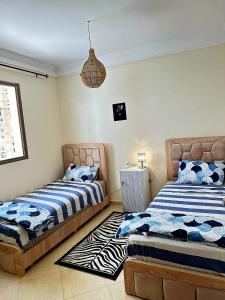 Postel nebo postele na pokoji v ubytování Charming Room Near Marrakech Airport