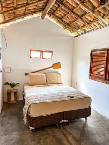 a bedroom with a large bed in a room at Refúgio CAJUÍ in Barreirinhas