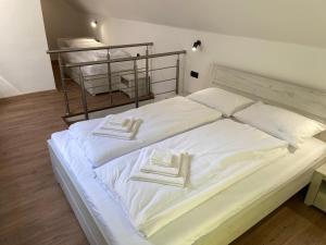 Postel nebo postele na pokoji v ubytování M3-Apartmány