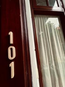 a close up of a door with a window at LushStay Private Dorm - Near Train Station - Free Water & Laundry in Hanoi