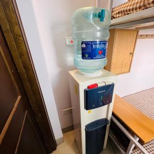 a jug of water sitting on top of a cooler at LushStay Private Dorm - Near Train Station - Free Water & Laundry in Hanoi