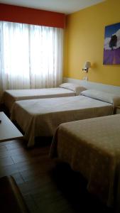 Katil atau katil-katil dalam bilik di HOSTAL Restaurante RANCHEIRO