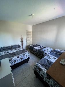 a room with three beds in a room at Descanso Milagres in São Miguel dos Milagres +5 photos