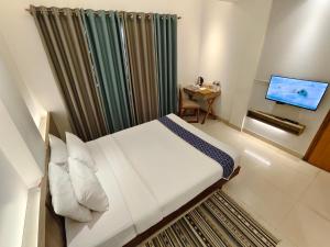 Postel nebo postele na pokoji v ubytování Hotel Nandini