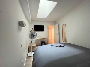 Postel nebo postele na pokoji v ubytování Pénitents Gris - 100m du Capitole - Beau T3 - parking