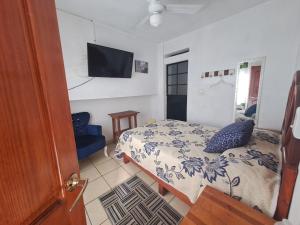 Postel nebo postele na pokoji v ubytování Hotel Las Palomitas