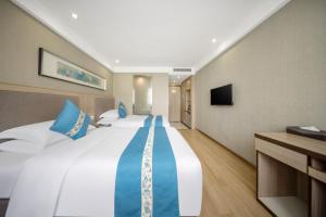 TV a/nebo společenská místnost v ubytování 义乌商洲宾馆国际商贸城店Yiwu Shangzhou Hotel - International Trade City