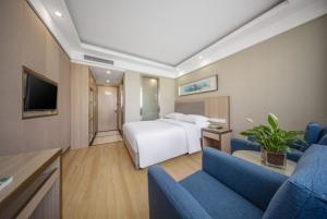 TV a/nebo společenská místnost v ubytování 义乌商洲宾馆国际商贸城店Yiwu Shangzhou Hotel - International Trade City