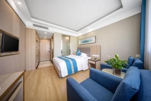 TV a/nebo společenská místnost v ubytování 义乌商洲宾馆国际商贸城店Yiwu Shangzhou Hotel - International Trade City