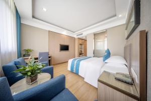 TV a/nebo společenská místnost v ubytování 义乌商洲宾馆国际商贸城店Yiwu Shangzhou Hotel - International Trade City