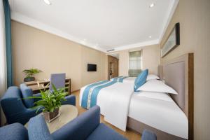 TV a/nebo společenská místnost v ubytování 义乌商洲宾馆国际商贸城店Yiwu Shangzhou Hotel - International Trade City