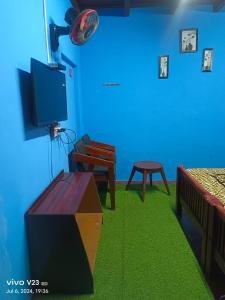 TV a/nebo společenská místnost v ubytování Munnar home stay + 37 fotografií