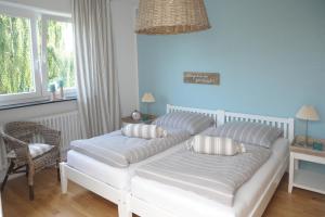 Postel nebo postele na pokoji v ubytování SEASIDE APARTMENTS - LIGHTHOUSE