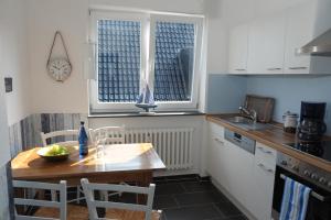 Kuchyň nebo kuchyňský kout v ubytování SEASIDE APARTMENTS - LIGHTHOUSE