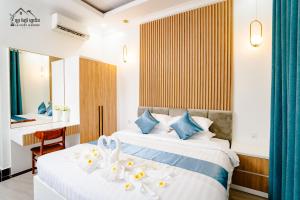 Postel nebo postele na pokoji v ubytování La Fairy Garden Resort + 131 fotografií