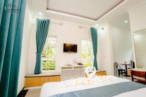 TV a/nebo společenská místnost v ubytování La Fairy Garden Resort