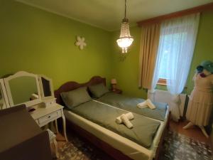 Posteľ alebo postele v izbe v ubytovaní Three Family Apartments