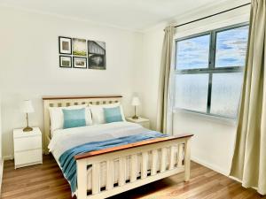 Ένα ή περισσότερα κρεβάτια σε δωμάτιο στο Heartwarming 3BR-Townhouse
