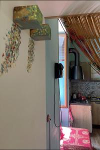 a kitchen with a refrigerator in a room at Famme sta cuiete appartamento Napoli centro in Naples