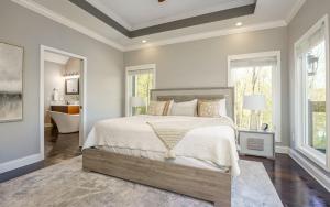 a bedroom with a large bed and a bathroom at Tranquility Paradise in Sevierville