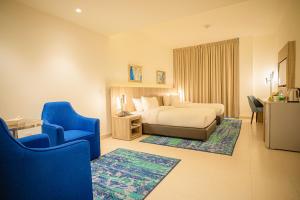 Postel nebo postele na pokoji v ubytování Golden Tulip Amman