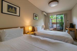 Fujiyama Inn Coniferにあるベッド