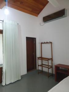 Postel nebo postele na pokoji v ubytování Wilpattu Corridor Leisure