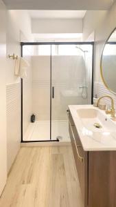 a bathroom with a shower and a sink and a tub at Eduardo Lucena Córdoba Center in Córdoba +14 photos