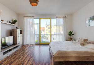 Postel nebo postele na pokoji v ubytování Köthen Loft Apartment