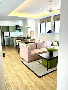 a living room with a couch and a table at C 1 Colombo Fort in Colombo