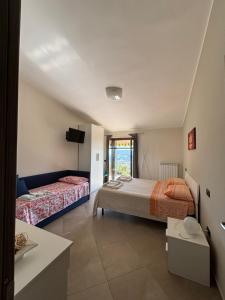 Posteľ alebo postele v izbe v ubytovaní B&B CASA MARTINA