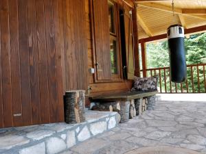 a porch of a house with a bench on it at Vila Bianka Žabljak Vikendica u selu Uskoci in Žabljak
