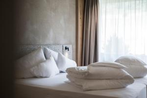 Giường trong phòng chung tại Hotel Patris