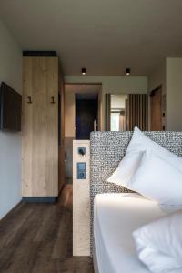 Giường trong phòng chung tại Hotel Patris