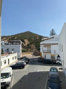 a street with cars parked in a parking lot at Turquesa 8 in Zahara de los Atunes