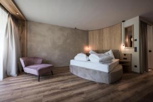 Giường trong phòng chung tại Hotel Patris