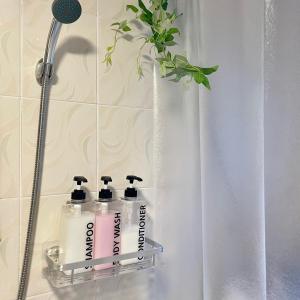 a group of four bottles of soap in a shower at sentimental in Busan +33 photos