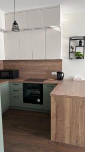 Η κουζίνα ή μικρή κουζίνα στο Apartament Rytm - Metro Kabaty