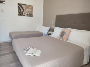 Postel nebo postele na pokoji v ubytování Hotel Madera
