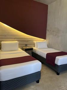 Voodi või voodid majutusasutuse Zenvea Hotel toas