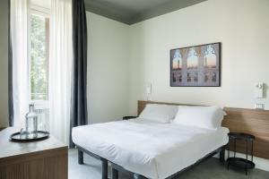 Postel nebo postele na pokoji v ubytování Hotel 22 Marzo + 24 fotografií