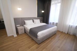 Ένα ή περισσότερα κρεβάτια σε δωμάτιο στο Ser In Hotel