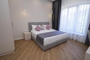 Ένα ή περισσότερα κρεβάτια σε δωμάτιο στο Ser In Hotel