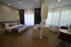 Ένα ή περισσότερα κρεβάτια σε δωμάτιο στο Ser In Hotel