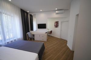 Ένα ή περισσότερα κρεβάτια σε δωμάτιο στο Ser In Hotel