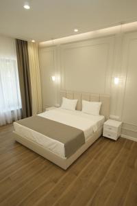 Ένα ή περισσότερα κρεβάτια σε δωμάτιο στο Ser In Hotel